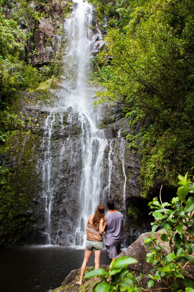 Couple relaxing at a waterfall