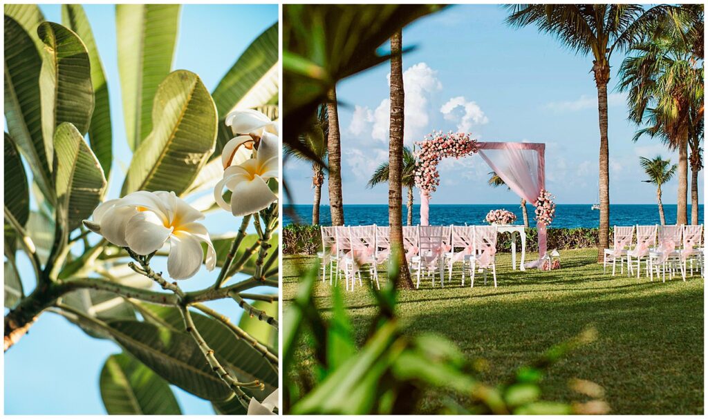 wedding arch and white chairs set for ceremony on grass with palm trees and ocean in the background. 