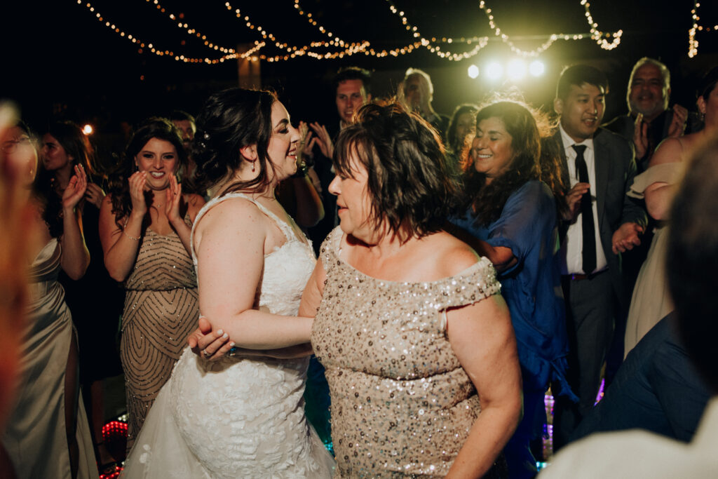 bride and her mom dancing during wedding reception